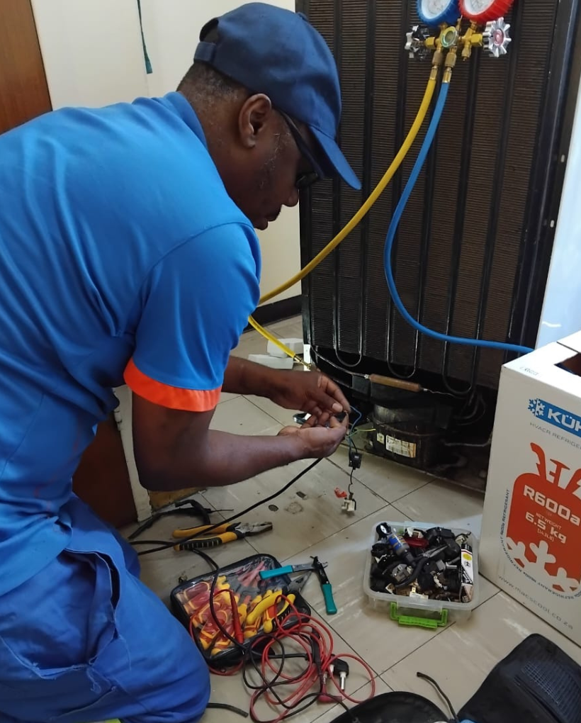 Emergency Bosch fridge repair technician fixing a Bosch refrigerator in Cape Town with fast same-day service