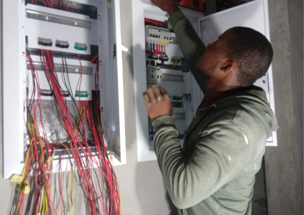 Professional electrician rewiring a house to improve electrical safety and performance in Cape Town.